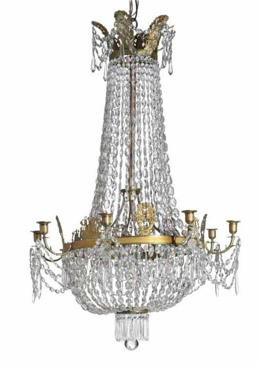 838 A French late Empire gilt bronze framed chandeliere, hung with prisms in