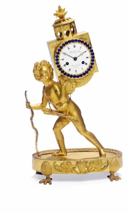 846 A French Empire gilt bronze mantel clock, Cupid carring the time, white enamel dial surrounded by blue enamel.