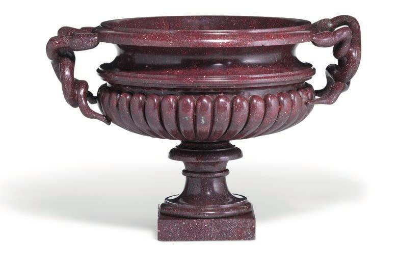 145 145 A large Italian porphyry tazza gadrooned bowl with twinsnake handles, on a circular waisted foot and square