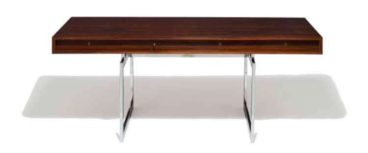 000 / 3.400-4.000 634 BODIL KJÆR b. 1932 Free-standing writing desk of rosewood. Frame of chromed steel.