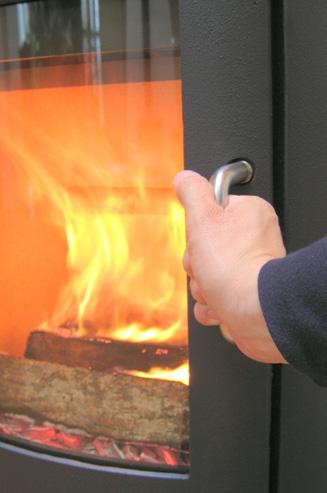 Close the door again once the wood has caught. 7. Reduce the amount of combustion air to the desired position, and the optimal combustion will continue.