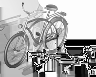 72 Opbevaring Fold hjuludsparingerne ud Løft holderen bagi (1), og træk den bagud. Slå holderen op (2). Fastgøring af den første cykel Fold begge hjuludsparinger ud.