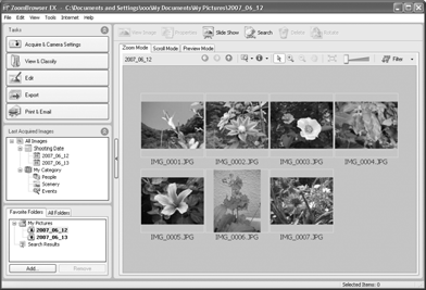 Overførsel af billeder til en computer 33 2. Brug knappen eller til at vælge de billeder, der skal overføres, og tryk på knappen. Billederne overføres. Knappen blinker blåt, mens overførslen foregår.