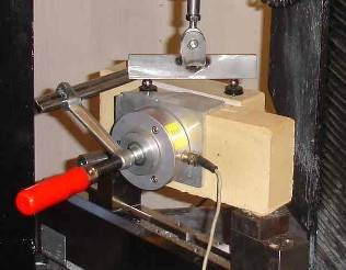 The mortaring is done in a gauge to ensure the correct measures. A clamp is put on to ensure against damage before testing, and the specimens are stored in 0 0 C, 6 % RH, until testing ().