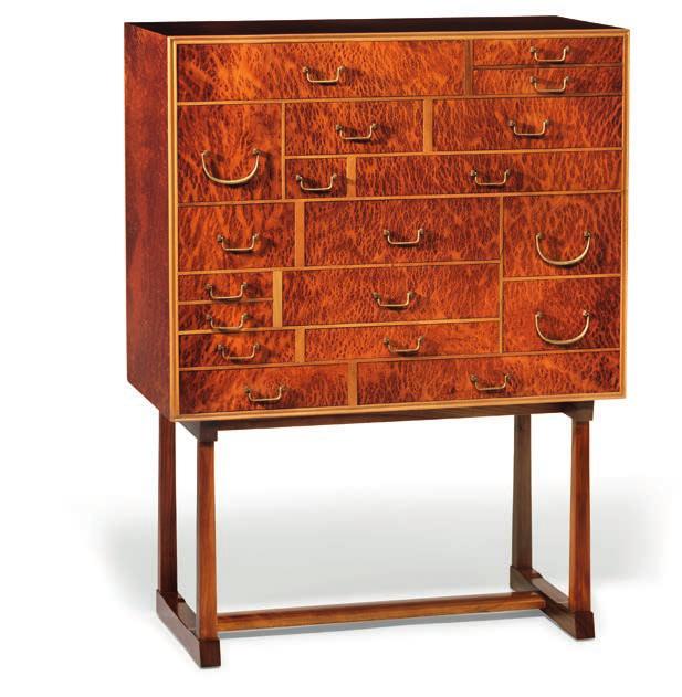 Front with 19 asymmetrical drawers with original brass handles. Model 881.