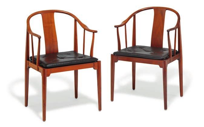 1208 HANS J. WEGNER b. Tønder 1914, d. Gentofte 2007 "China Chair". A pair of nut wood armchairs. Loose seat cushion upholstered with brown leather, fitted with buttons. Model 4283.