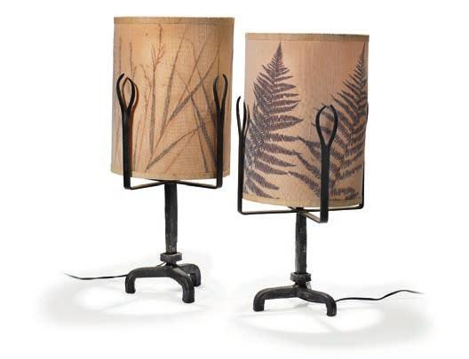 1240 1240 DIEGO GIACOMETTI, STYLE OF A pair of table lamps with three-legged patinated cast iron frame, enclosed