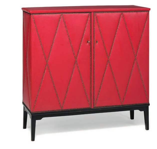 1255 SWEDISH DESIGN Cabinet with black lacquered frame. Sides, top and two doors in front covered with red vinyl, fitted with brass nails in harlequin pattern. Interior with shelves.