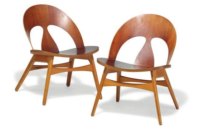 1278 1278 BØRGE MOGENSEN b. Aalborg 1914, d. Gentofte 1972 A pair of low lounge chairs with beech frames. Seat and back of moulded, laminated teak. Designed 1949.
