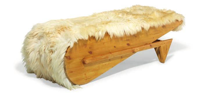 1281 UNKNOWN DESIGNER A "wheelbarrow" daybed with pine frame. Seat upholstered with shaggy sheepskin. Made 20.