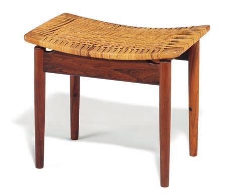 1284 FINN JUHL b. Frederiksberg 1912, d. Ordrup 1989 Rare stool with round Brazilian rosewood legs, seat frame of nut wood. Seat with woven cane.