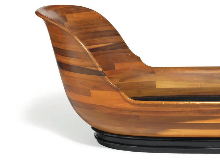 1291 PEDER MOOS b. Nybøl 1906, d. Bredebro, Tønder 1991 "Bateau Lit". Boat shaped bed of solid walnut wood, thick profiled edge. Mounted on profiled plinth of black painted pine.