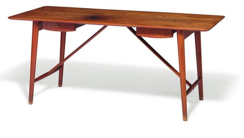 Ålborg 1907, d. Hellerup 1993 Freestanding solid teak desk with round, tapering legs and oval stretchers. Front with two drawers with brass fittings.