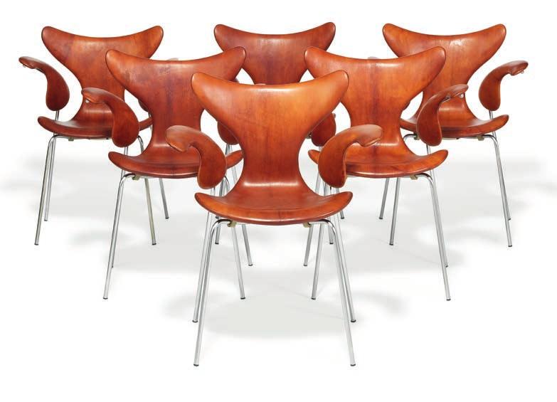 1307 ARNE JACOBSEN b. Copenhagen 1902, d. s.p. 1971 "Seagull". A set of 12 armchairs with chromed steel frame. Seat, back and armrests upholstered with patinated, cognac coloured Niger leather.
