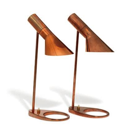 DKK 60,000-80,000 / 8,050-11,000 1309 ARNE JACOBSEN b. Copenhagen 1902, d. s.p. 1971 "AJ". A rare pair of small table lamps of copper/copper-plated metal.