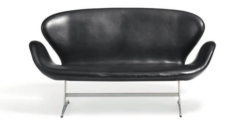 Egg-shaped top of black lacquered ash. Model 3603. Designed 1952.