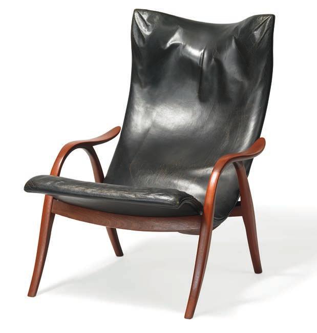 1338 * FRITS HENNINGSEN b. 1889, d. 1965 Easy chair with curvy mahogany frame. Seat and back upholstered with black leather. Designed 1954. This example made approx.