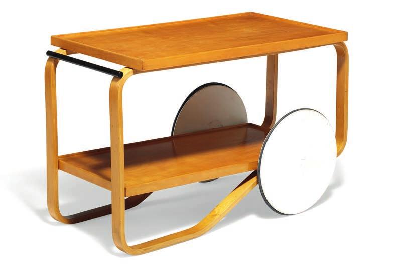 1013 ALVAR AALTO b. Kuortane 1898, d. Helsinki 1976 Early tea trolley of patinated birch with shelf and black lacquered handle. Mounted with two white wheels with black rubber edge. Model 91.