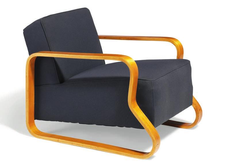 1015 ALVAR AALTO b. Kuortane 1898, d. Helsinki 1976 A low lounge chair with moulded birch frame. Seat and back upholstered with blue fabric. Model 44. Designed 1932.