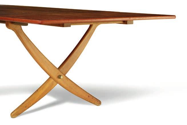 There is a long-standing tradition of furniture pieces with cross-legs, and in Wegner s dining table version, with the elegantly sweeping yet still light and organic saber legs, they are held in
