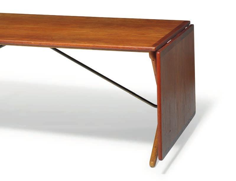1019 1019 HANS J. WEGNER b. Tønder 1914, d. Gentofte 2007 "AT 314". A teak dining table with fold-down leaves, mounted on oak frame with cross-legs and brass stretchers.