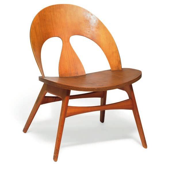 1023 BØRGE MOGENSEN b. Aalborg 1914, d. Gentofte 1972 A low lounge chair with cherry frame. Seat and back of moulded, laminated teak. Designed 1949. This example made approx.
