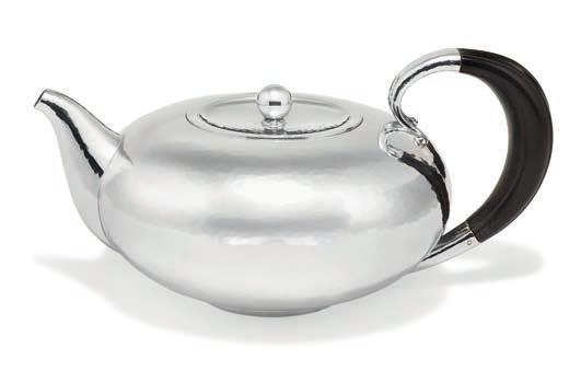 1030 1030 JOHAN ROHDE b. Randers 1856, d. Hellerup 1935 Sterling silver teapot with hammered surface. Handle of carved ebony. Georg Jensen after 1977. With date letter X10=1995. Design no. 787.