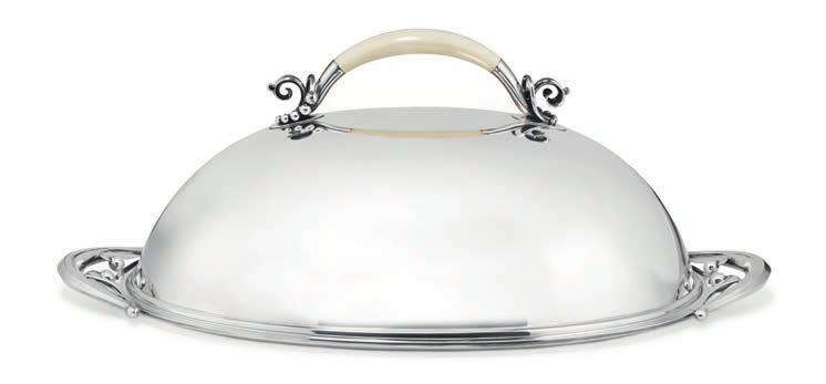 1039 1039 HOLGER RASMUSSEN b. Denmark, silversmith Large, oval silver serving dish and cover with openwork handles with ivory handle.