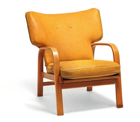 1099 1099 MAGNUS L. STEPHENSEN b. Holte 1903, d. Helsingør 1984 Easy chair with moulded beech frame, seat with woven cane.