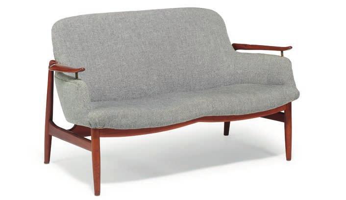 1127 1127 FINN JUHL b. Frederiksberg 1912, d. Ordrup 1989 "FJ 53". Freestanding two seater teak sofa with "floating" armrests on brass fittings. Sides, seat and back upholstered with light grey wool.