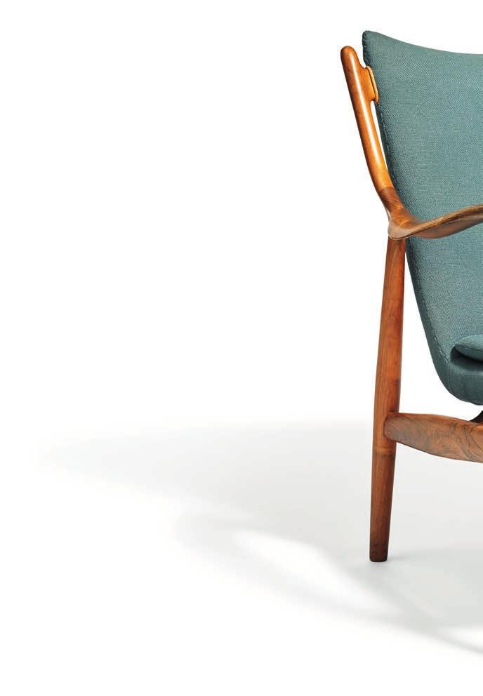1154 FINN JUHL b. Frederiksberg 1912, d. Ordrup 1989 "FJ 45". A Brazilian rosewood easy chair. Seat, back and loose seat cushion upholstered with blue wool.