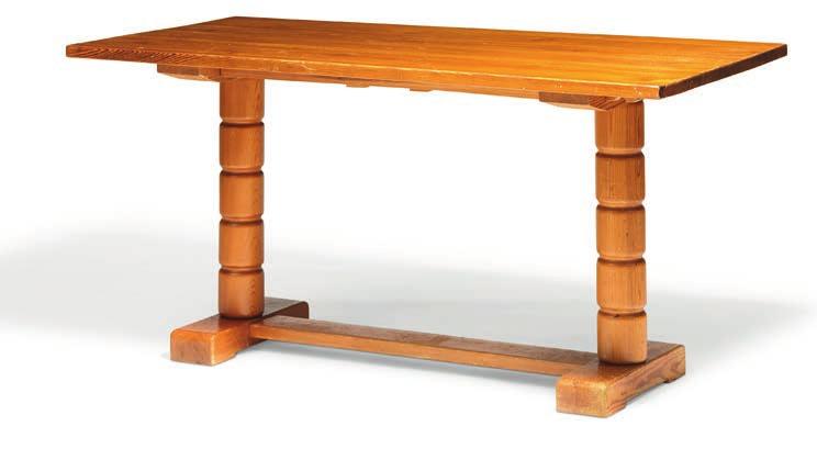 1169 NORDISKA KOMPANIET Rectangular dining table of solid pine with two extra leaves. Mounted on carved legs with cross stretcher.
