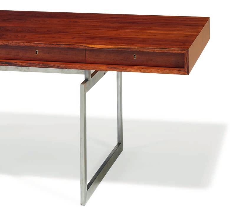 1195 BODIL KJÆR b. Hatting 1932 Freestanding writing desk of Brazilian rosewood with chromed steel frame. Top with four integrated drawers in rail.