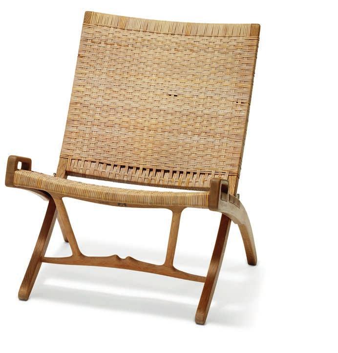 1200 HANS J. WEGNER b. Tønder 1914, d. Gentofte 2007 "JH 512". A pair of patinated oak folding chairs with two original brackets for wall mounting. Seat and back with woven cane. Designed 1949.