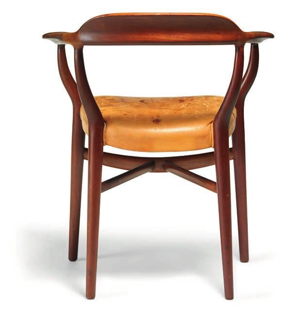 1005 FINN JUHL b. Frederiksberg 1912, d. Ordrup 1989 "FJ 44". Immensely rare armchair with sculptural Cuban mahogany frame. Seat upholstered with natural leather. Designed 1944.