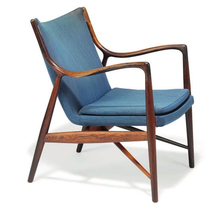 1024 FINN JUHL b. Frederiksberg 1912, d. Ordrup 1989 "FJ 45". A Brazilian rosewood easy chair. Seat, back and loose seat cushion upholstered with original, blue wool fabric. Designed 1945.
