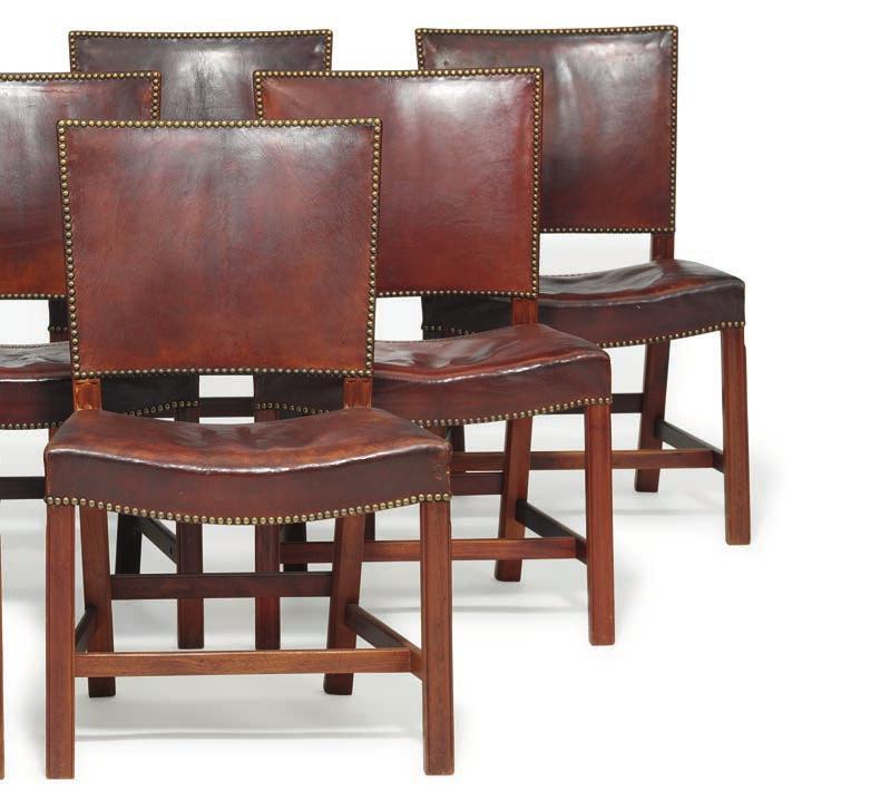 1029 KAARE KLINT b. Frederiksberg 1888, d. Copenhagen 1954 "The Red Chair". A set of nine large Cuban mahogany chairs with profiled frames.