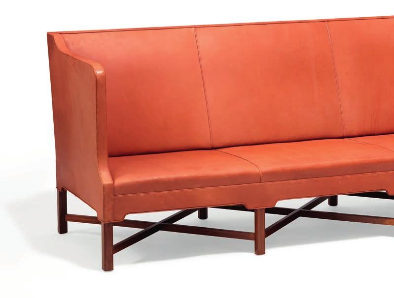1032 1032 KAARE KLINT b. Frederiksberg 1888, d. Copenhagen 1954 Freestanding three seater sofa on eight-legged mahogany cross-frame. Sides, seat and back upholstered with reddish brown leather.