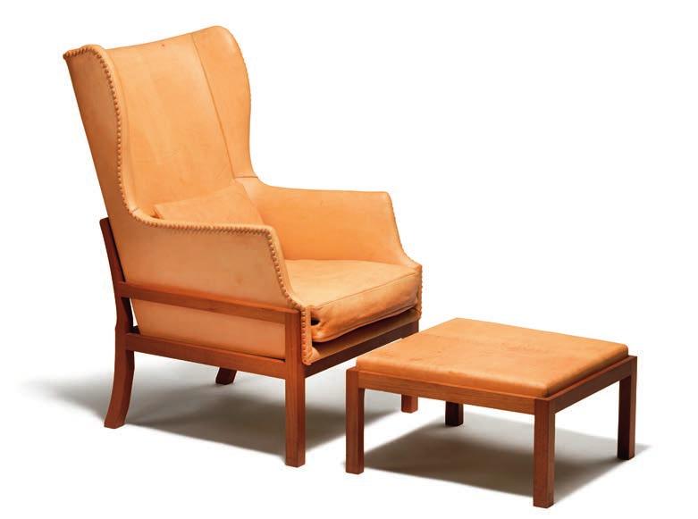 1051 MOGENS KOCH b. Frederiksberg 1898, d. Copenhagen 1992 Wingback chair with matching foot stool of mahogany.