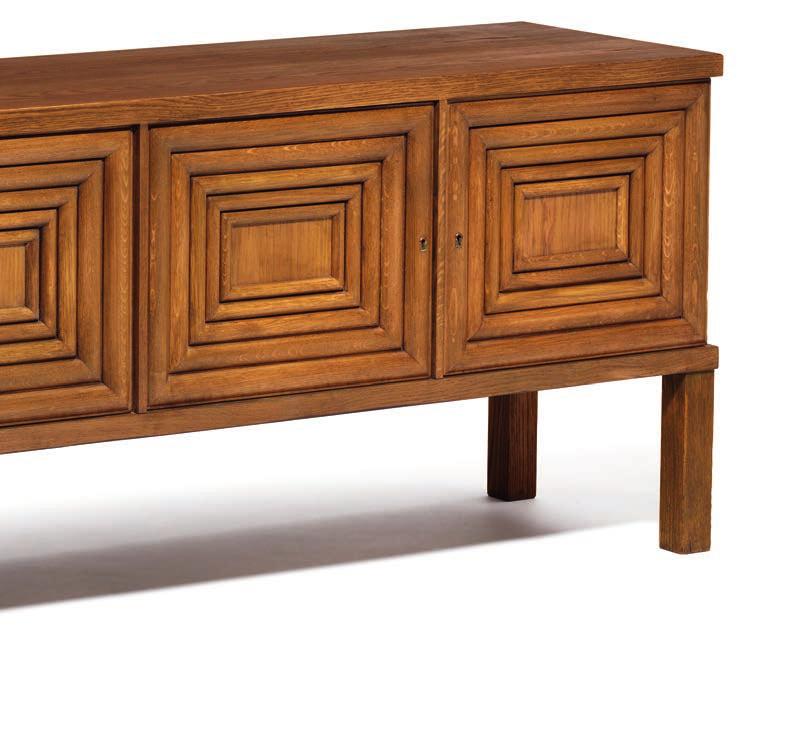 1053 OSCAR NILSSON Sweden, 20th century Oak sideboard. Sides and front with four doors, each divided into geometric pattern.