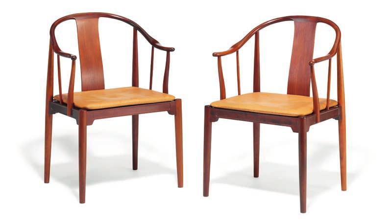 1072 HANS J. WEGNER b. Tønder 1914, d. Gentofte 2007 "China chair". A pair of Cuban mahogany armchairs. Loose seat cushion upholstered with natural patinated leather, fitted with buttons. Model 4283.