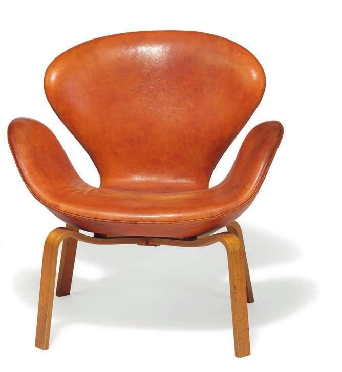 1086 ARNE JACOBSEN b. Copenhagen 1902, d. s.p. 1971 "The Swan". A pair of rare easy chairs with laminated moulded teak frame. Seat upholstered with patinated natural leather. Model 4325.