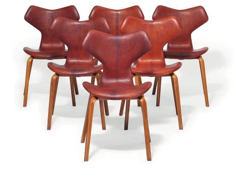 1089 ARNE JACOBSEN b. Copenhagen 1902, d. s.p. 1971 "Grand Prix". A set of 12 chairs with laminated teak legs. Seat and back upholstered with reddish brown leather. Model 4130. Designed 1957.