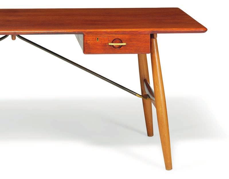 1116 HANS J. WEGNER b. Tønder 1914, d. Gentofte 2007 "JH 571". Freestanding solid teak desk on slightly oblique oak legs. Front with two drawers.