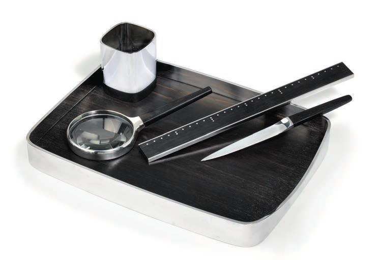 900 HENNING KOPPEL b. Copenhagen 1918, d. s.p. 1981 Sterling silver and ebony writing set. Comprising a paper tray, a paper knife, a magnifying glass, a pen holder and a ruler.