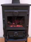 5. Refuelling of your stove should be done while there are still glowing embers in the bed. Spread the embers across the bottom, but concentrated mostly towards the front of the stove.
