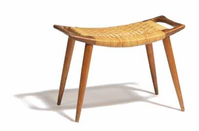 700 543 HANS J. WEGNER b. 1914, d. 2007 Stool of oak. Sides with carved handles. Tapering legs with visible joints. Seat upholstered with cane. Made by cabinetmaker Johannes Hansen. DKK 8.000 / 1.