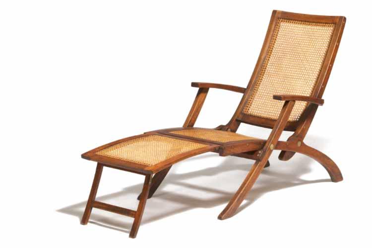1954 Deck chair of teak with seat, back and adjustable leg support with woven cane.