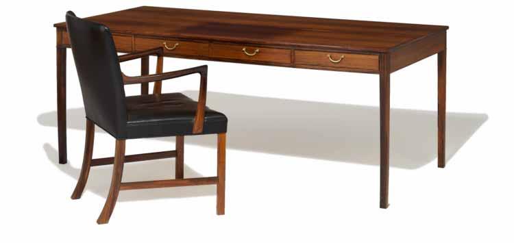 700 612 OLE WANSCHER 611 b. 1903, d. 1985 Armchair and writing desk of rosewood. Rail with four drawers, handles of brass.