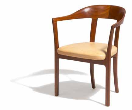 613 614 613 OLE WANSCHER b. 1903, d. 1985 Armchair of rosewood with slightly round back.